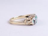 an image of a ring with a blue topaz stone
