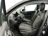 the interior of a car with the door open and the driver ' s seat down