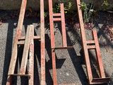 several pieces of wood are sitting on the ground next to the steps