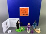 an assortment of figurines of people in various poses
