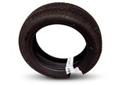 a tire that is sitting on a white surface
