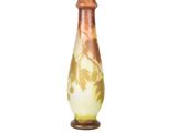 a vase that has a brown and white design on it