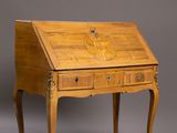 an antique writing desk with two drawers and a drawer underneath it