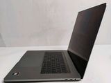 a laptop computer sitting on a table with a cup of coffee