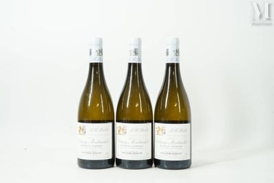 three bottles of wine sitting on top of a table next to each other