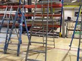 many ladders that are sitting in a room
