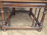 a wooden table with a bowl of fruit on top of it