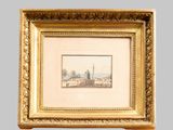 an old picture of a picture of a city in a gold frame