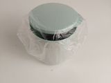 a cupcake in a plastic container on a table