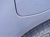 a close up view of a car ' s tire with a sticker on it