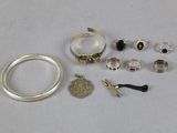 a lot of different rings and bracelets on the table