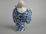 blue and white porcelain figurine of a man with a blue robe
