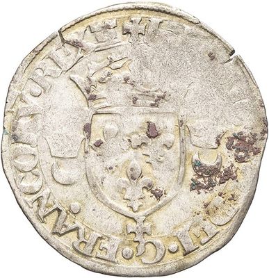 a close up of a coin with a coat of arms on it