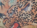 a picture of a painting of a leopard on the wall