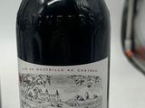 a bottle of wine that is sitting on a table