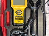 a yellow and black device sitting in a red case