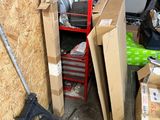 a pile of boxes and other items in a garage