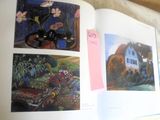a book with pictures of cats and dogs on it