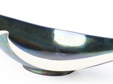 a black and white bowl on a white surface