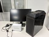 a desktop computer sitting on a desk next to a computer monitor