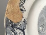 a plate with a picture of a man and a woman on it