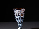 a glass cup that is sitting on a table