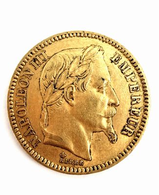 l'image d'une pièce d'or sur laquelle figure le visage d'un homme