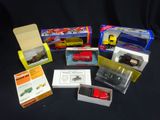 many different types of toy trains in boxes on a table