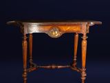 an old wooden table with a lion head on top of it