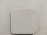 an image of a white square button on a white surface