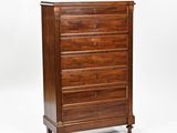 an image of a wooden chest of drawers against a white background