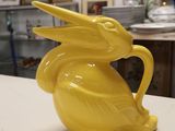 a yellow ceramic bunny mug sitting on a counter