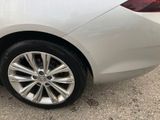a close up of a car ' s tire on the road