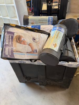 a box full of items sitting on the floor in a room