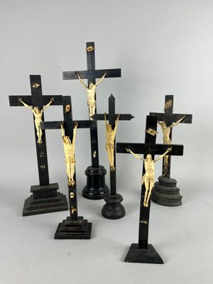 four black and gold crucifs with jesus on the cross