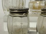 two salt and pepper shakers sitting on a table
