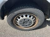 a close up of a flat tire on a car