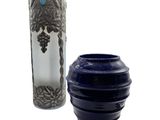 two vases that are next to each other on a table
