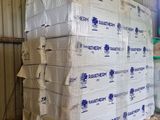 a large pile of white paper sitting in a barn