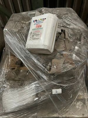 a lot of plastic wrap on a table with a remote control
