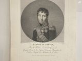 une vieille photo d'un homme en uniforme militaire, exposée dans une vitrine