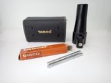 a small black tube and a black case on a white table
