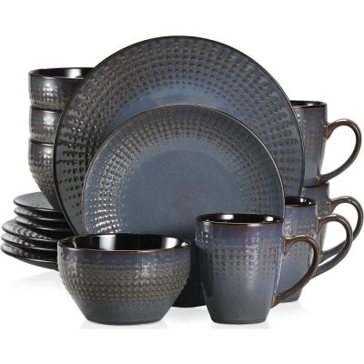 a set of blue dishes and cups on a white background