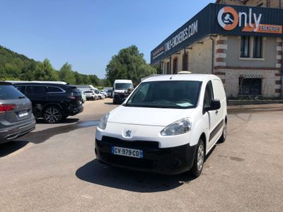 a white van that is parked in front of a building