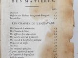 an old book with writing on it sitting on top of a table