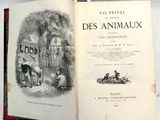 un livre ouvert avec l'image d'un homme et d'un chien
