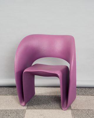 an image of a purple chair sitting on top of a checkered floor