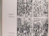 a black and white picture of a book with pictures of people