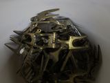 a close up of a metal object on a white surface