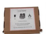 a cardboard box with a sign on it that says caution